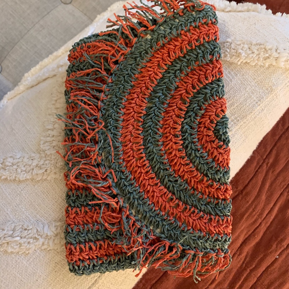 Green and coral straw clutch
